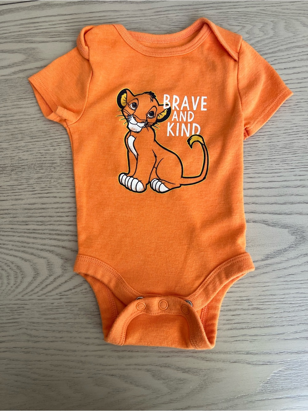Disney Orange 'Brave and Kind' Lion Cub One-Piece Bodysuit